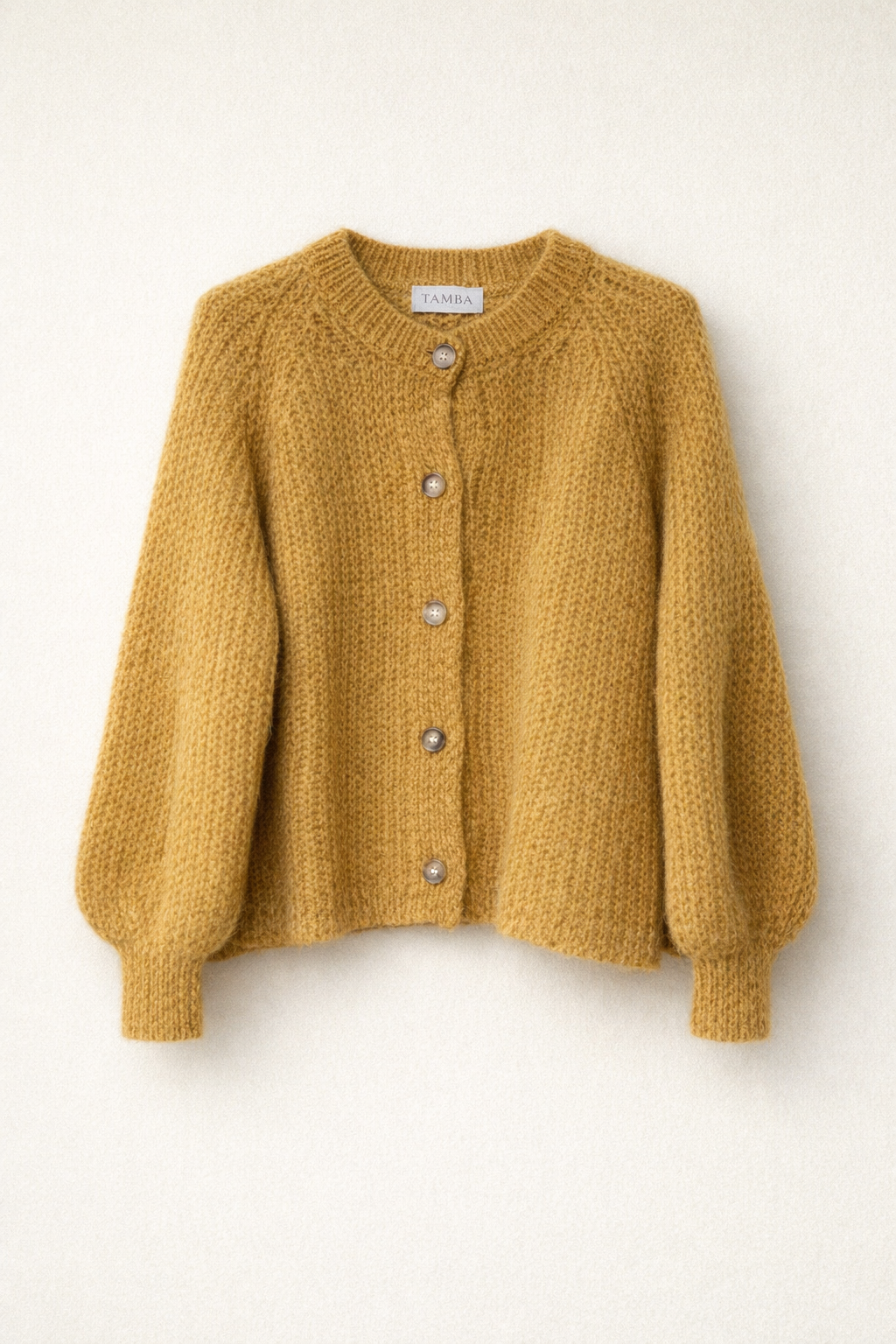 Mohair-Strickjacke mit Knopfleiste
: Bernstein / Einheitsgröße