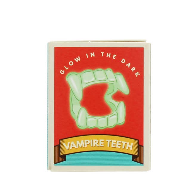 REX - Leuchtende Vampirzähne im Dunkeln