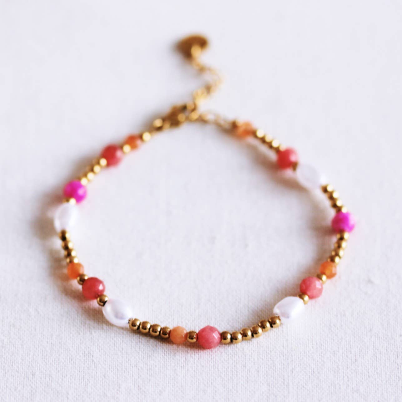 Perlenarmband mit facettierten Perlen – Koralle/Orange/Rosa
