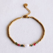 Perlenarmband mit Perle und facettierten Perlen – grün/cerise